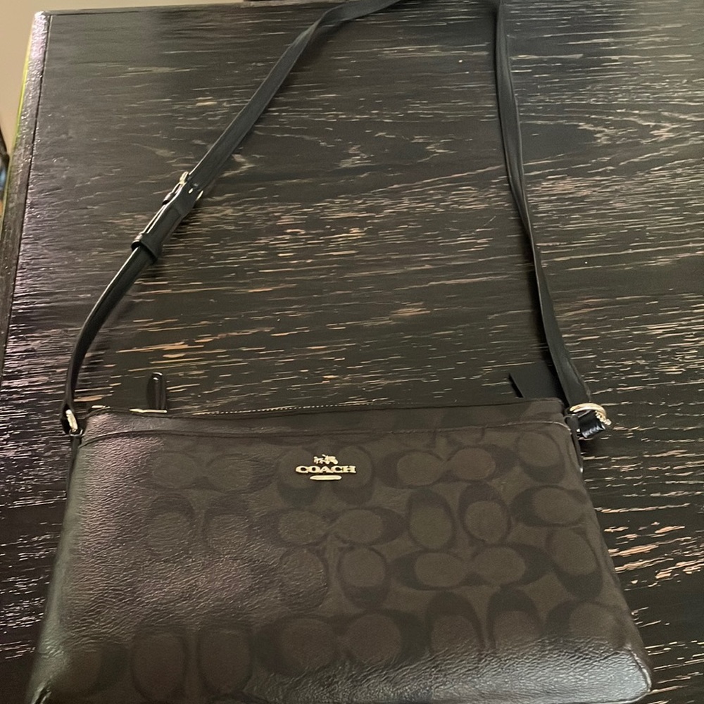 Black and brown signature coach cross body